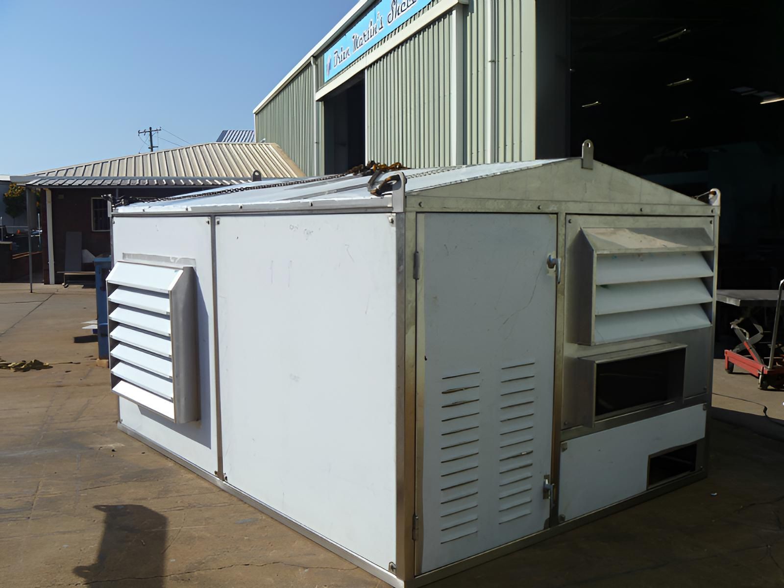 A White Building With A Sign That Says Stainless Steel On It — Brian Martin's Sheet Metal In North Mackay, QLD
