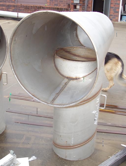 A Stainless Steel Pipe With A Hole In The Middle — Brian Martin's Sheet Metal In North Mackay, QLD