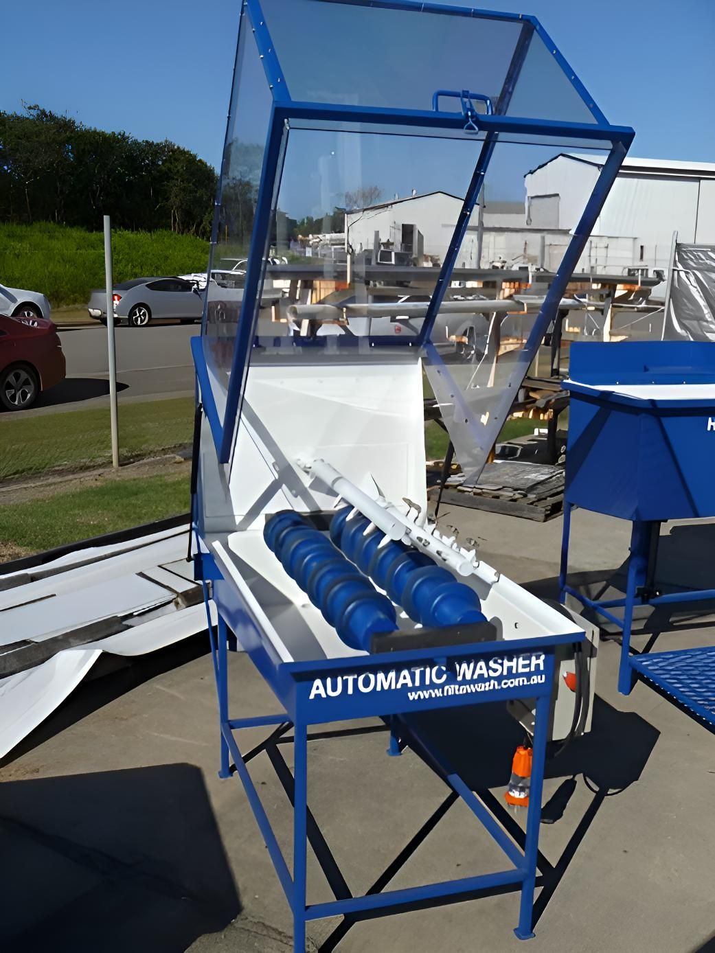 A Blue and White Machine That Says Automatic Washer On It — Brian Martin's Sheet Metal In North Mackay, QLD