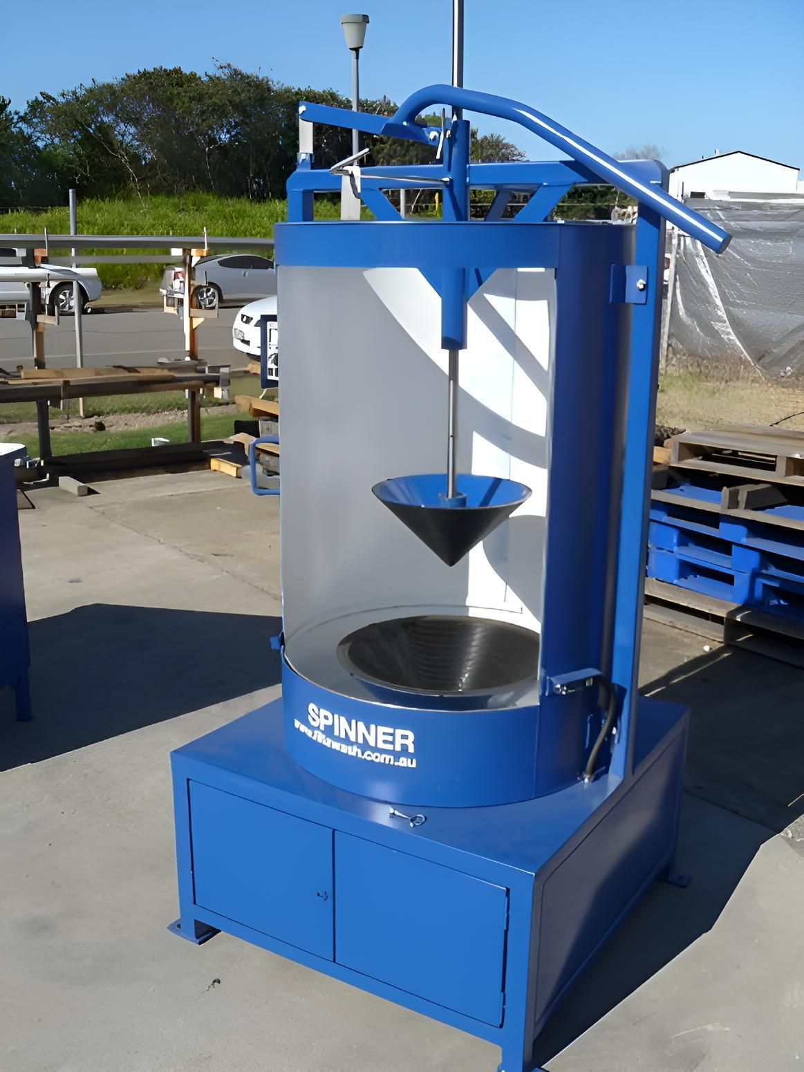 A Blue Spinner Machine Is Sitting On The Ground — Brian Martin's Sheet Metal In North Mackay, QLD