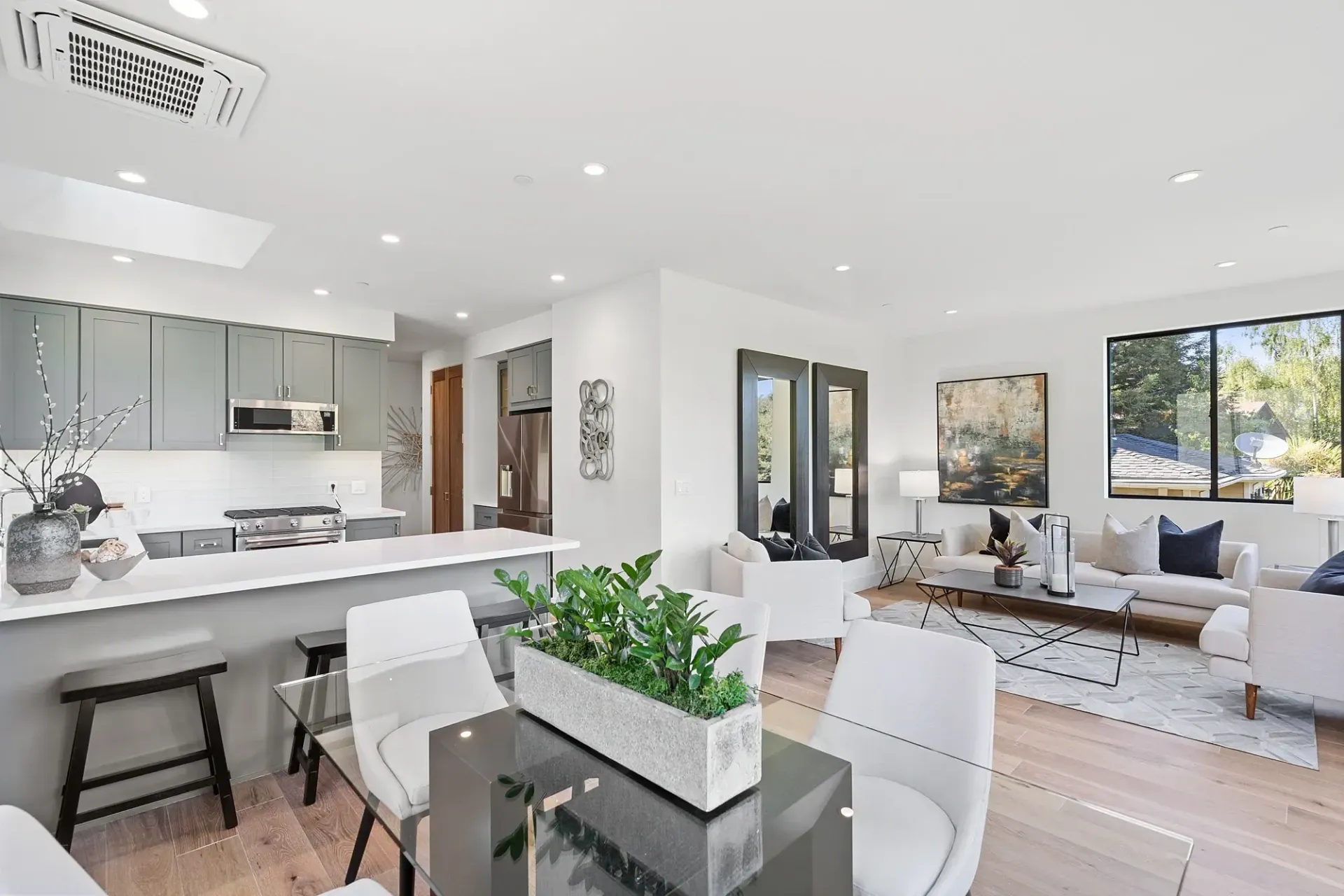 Bright, open-concept living space with kitchen, dining, and living areas.