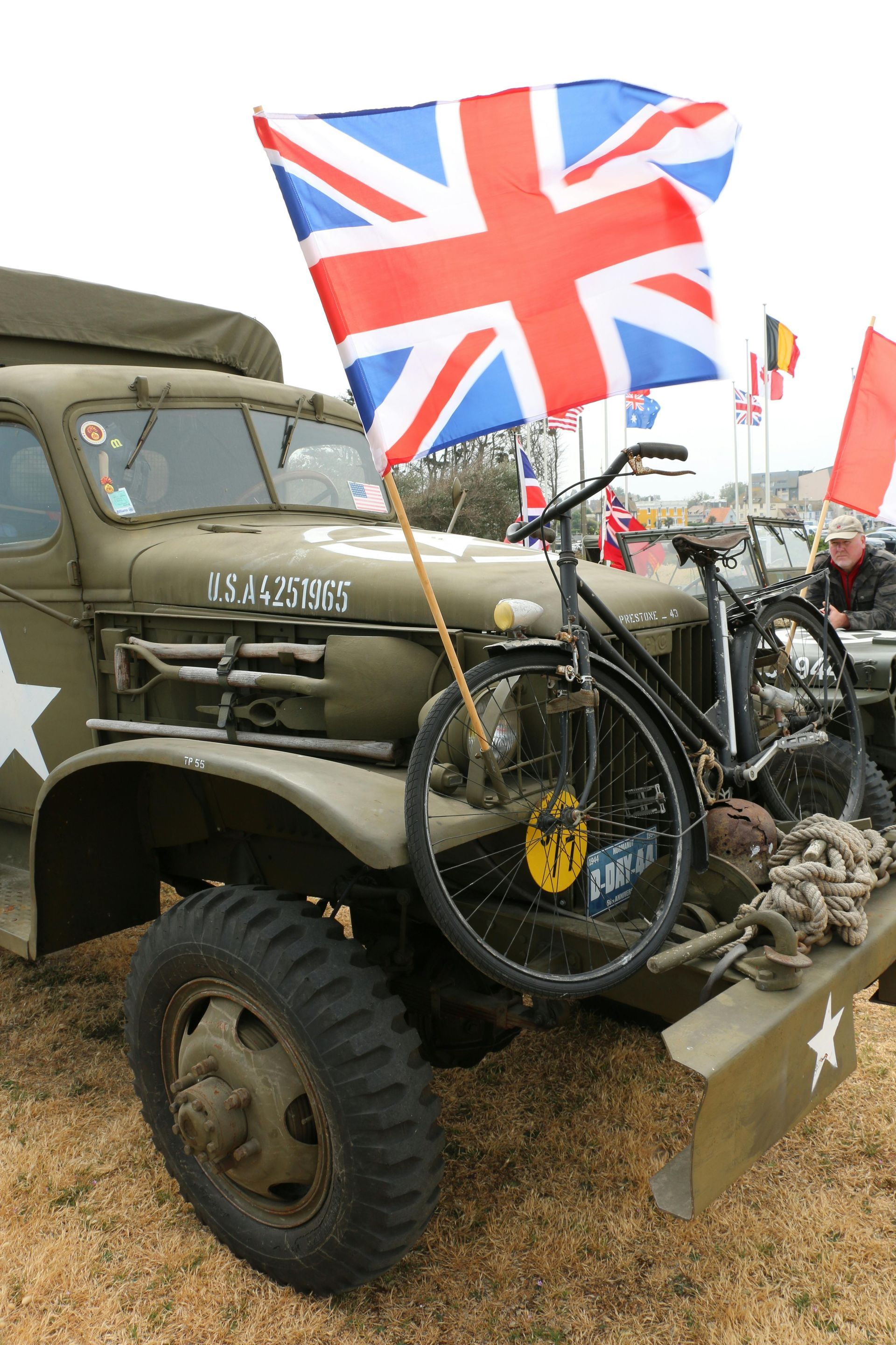 Historic WWII military vehicle, displayed at a Normandy D-Day commemoration event.