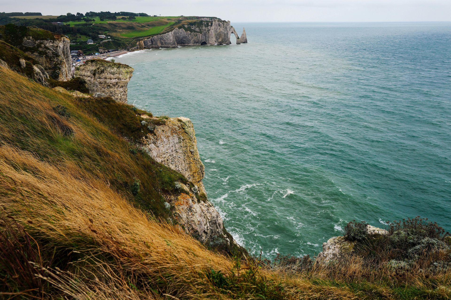  Scenic coastal cliffs of Normandy overlooking the sea, a must-visit destination in France.