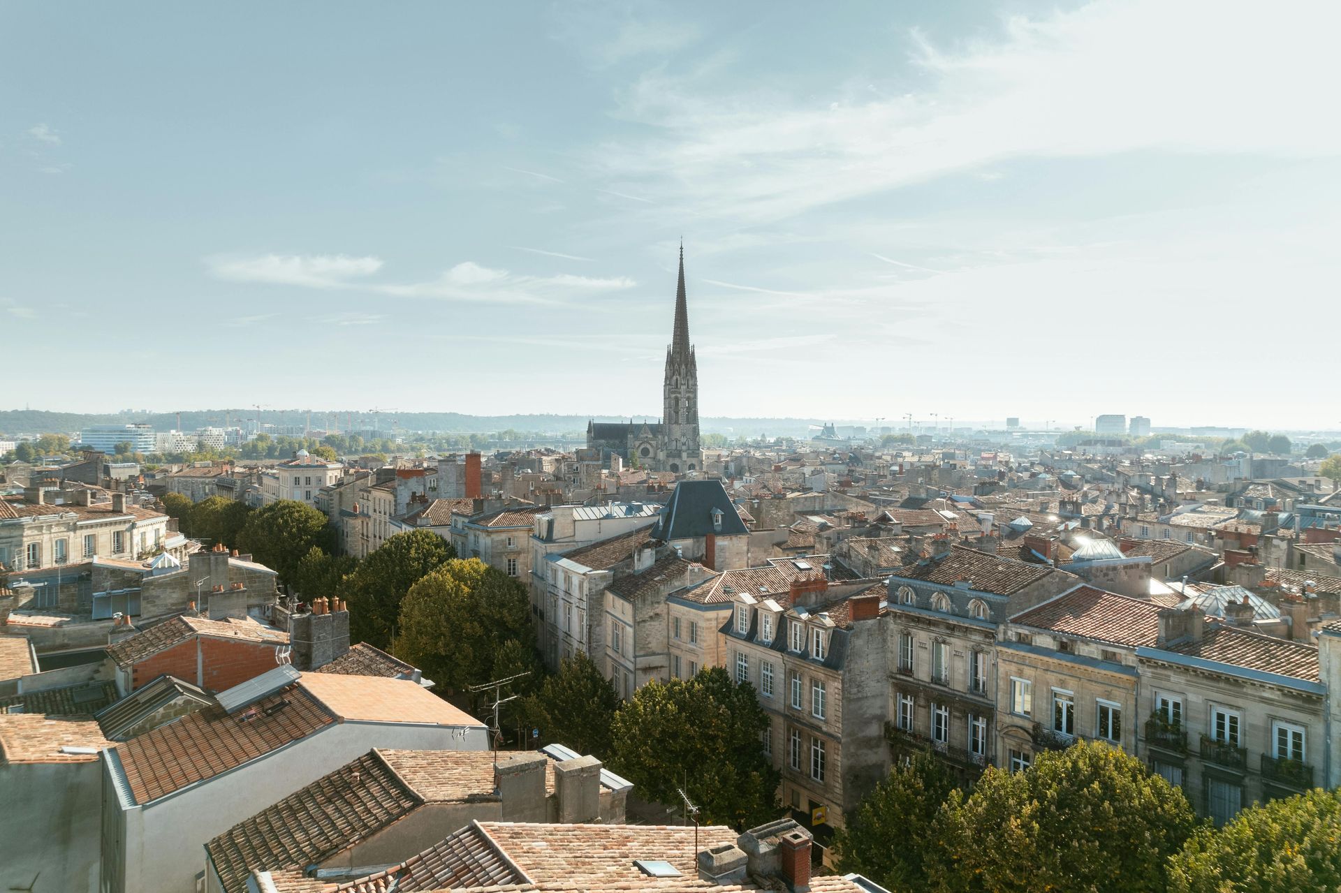 Panoramic view of Bordeaux’s rooftops, featuring Saint-Michel Basilica and the historic cityscape