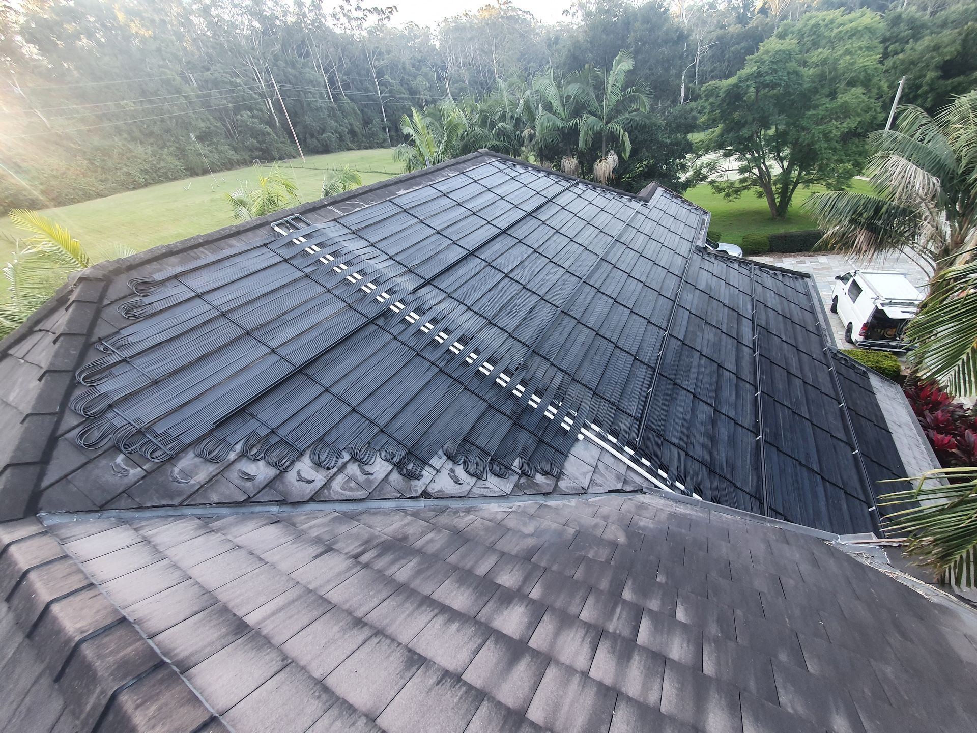 An Aerial View of a House With Solar Panels on the Roof — Solar Services in Erina, NSW