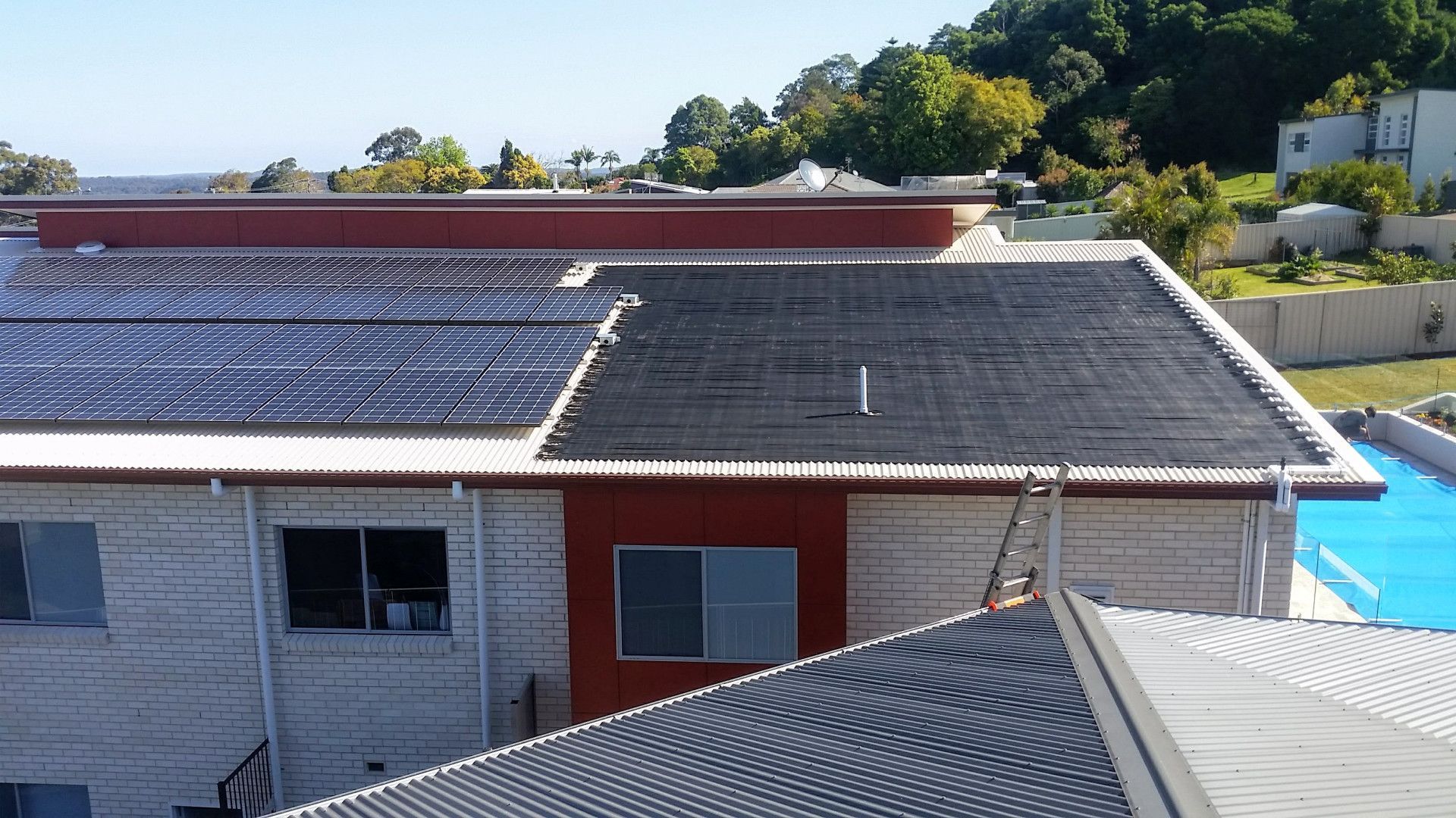Solar Panels on a Building's Roof — Solar Services in Erina, NSW