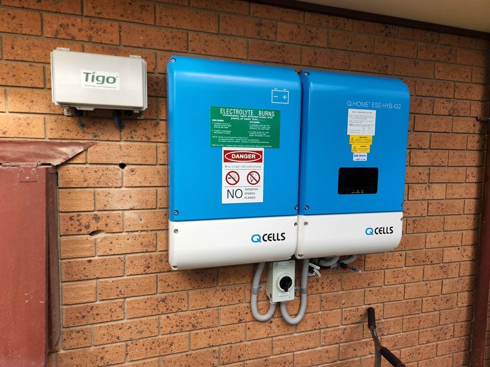 Blue Utility Meter Box Mounted On A Brick Wall — Solar Services in Erina, NSW