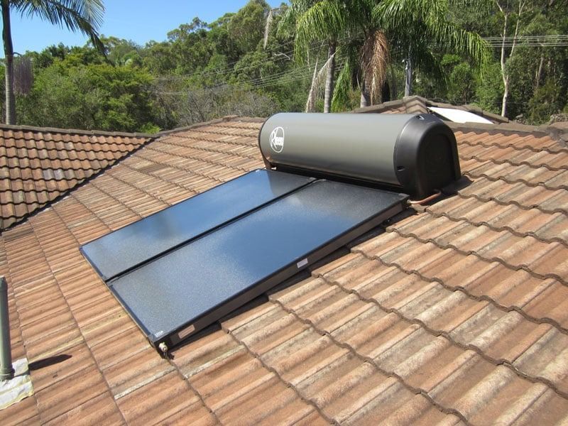 A Solar Panel is Sitting on Top of a Tiled Roof — Solar Services in Gosford, NSW
