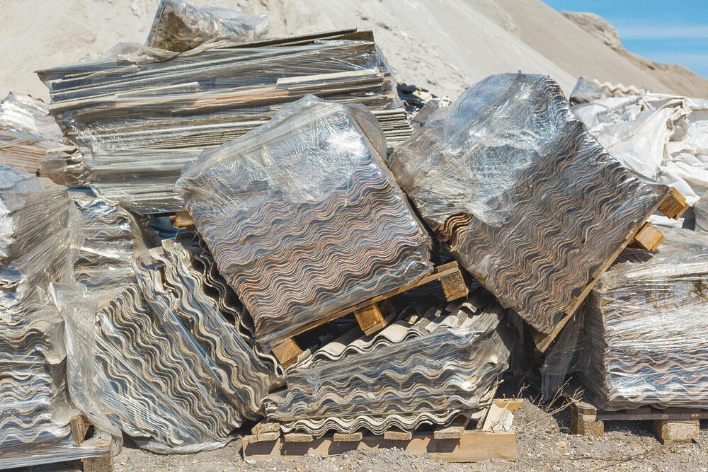 Bundled Stacks of Corrugated, Silver Material on Pallets, Likely for Recycling — Hasti Skips in Murwillumbah, NSW