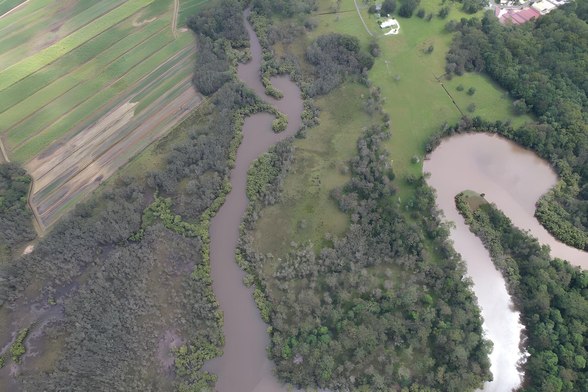 Aerial View Meandering River Through Green Trees and Farmland — Hasti Skips in Brunswick Heads, NSW