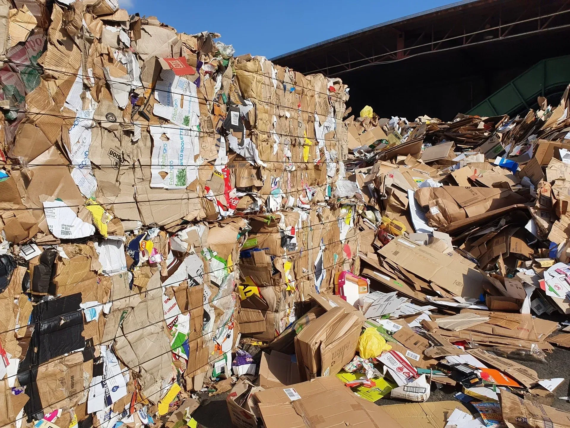 Bales of Flattened Cardboard Stacked at a Recycling Center — Hasti Skips in Bangalow, NSW