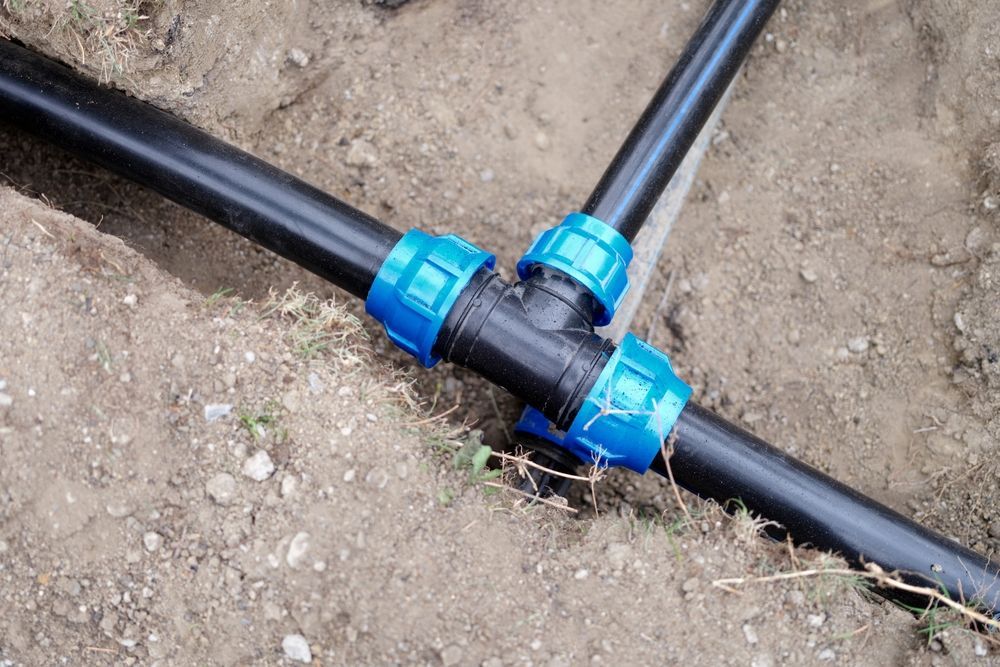A Close Up of a Hose Connected to a Pipe — Foreshore Plumbers In Tuncurry, NSW