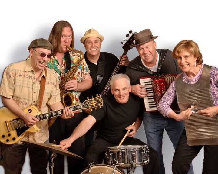 A group of musicians are posing for a picture together