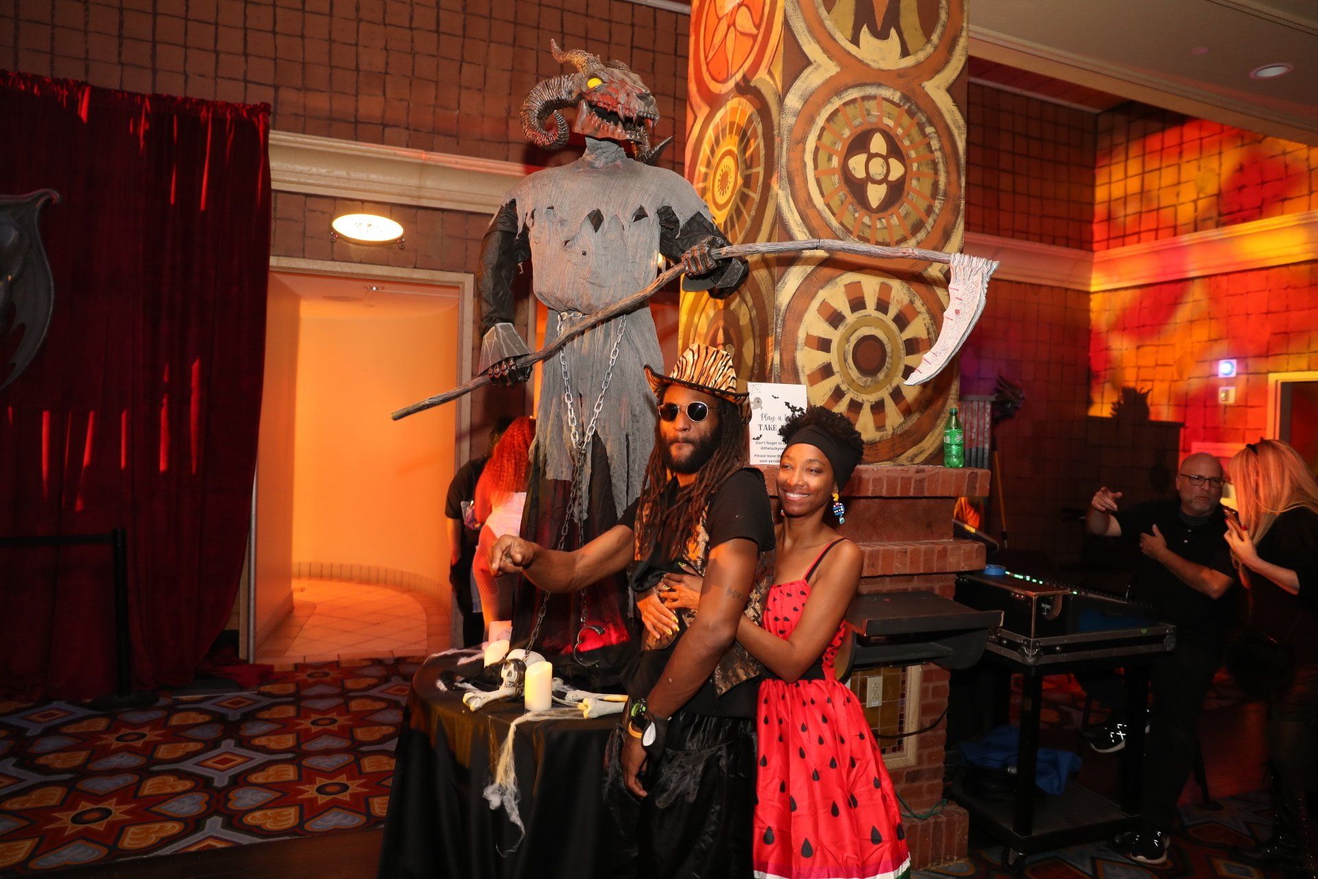 A group of people are posing for a picture in a room.