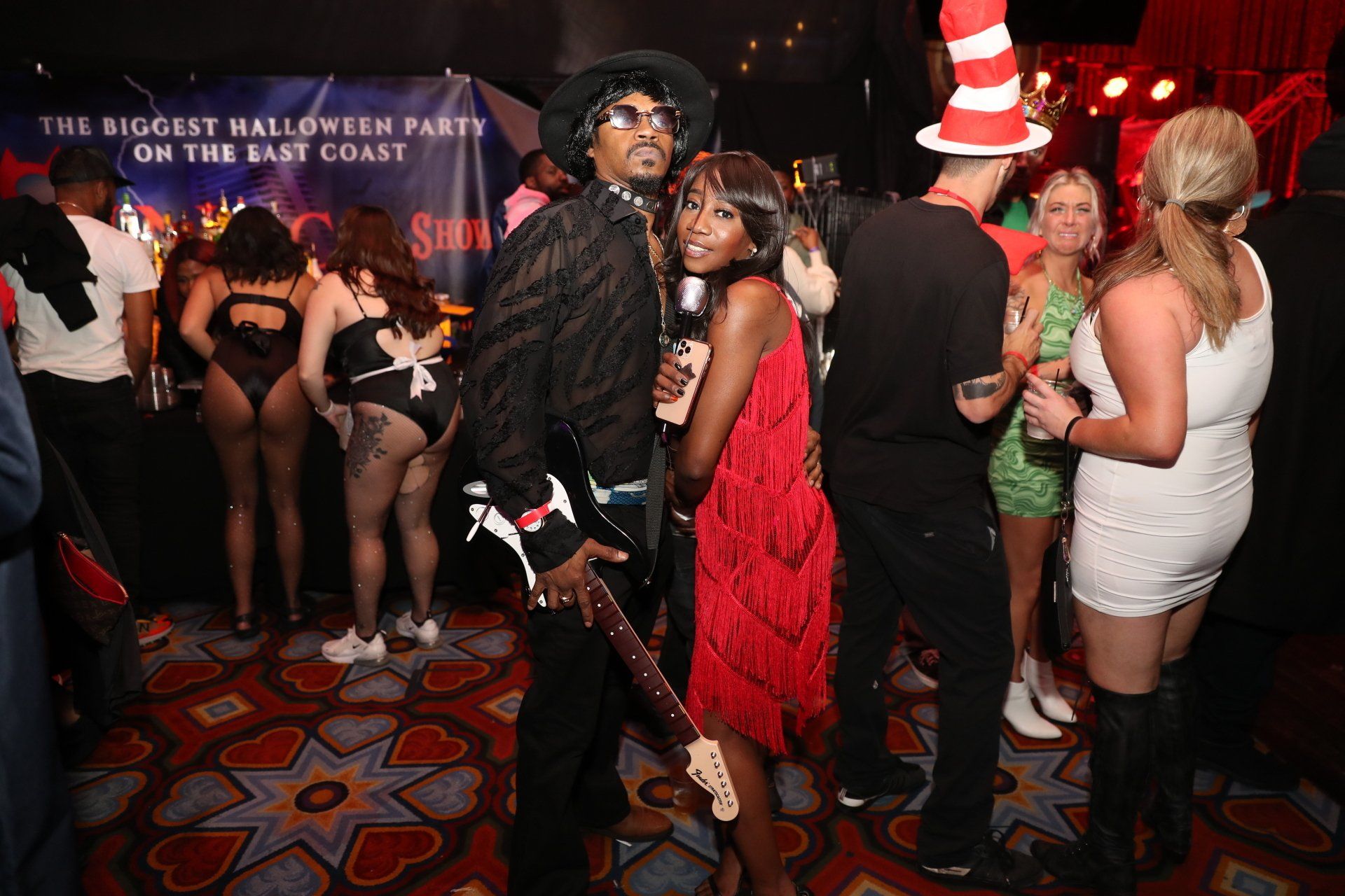 A group of people are dancing at a halloween party on the east coast