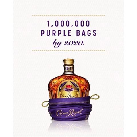A bottle of crown royal is wrapped in a purple bag