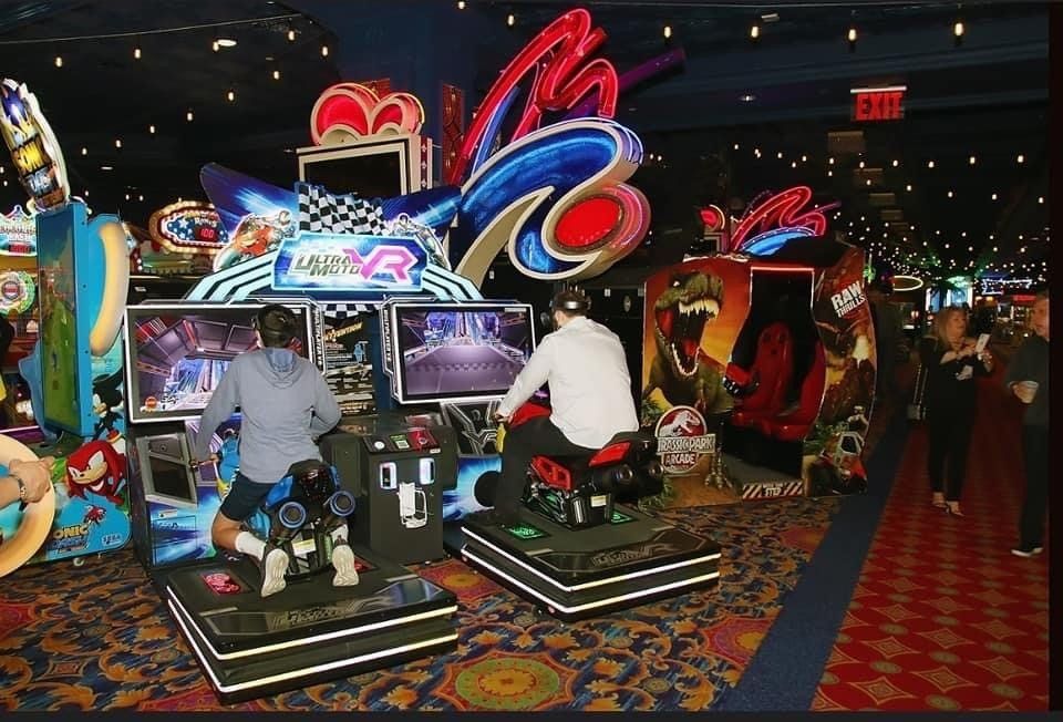 A group of people are playing a video game called mad vr