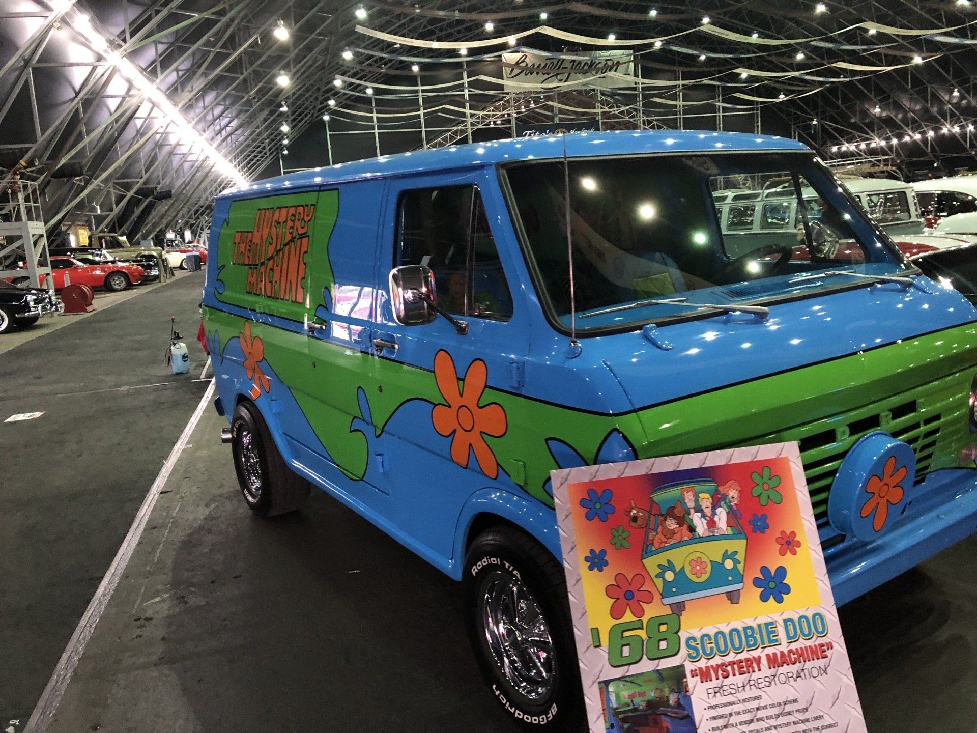 a blue scooby doo van parked in a parking lot