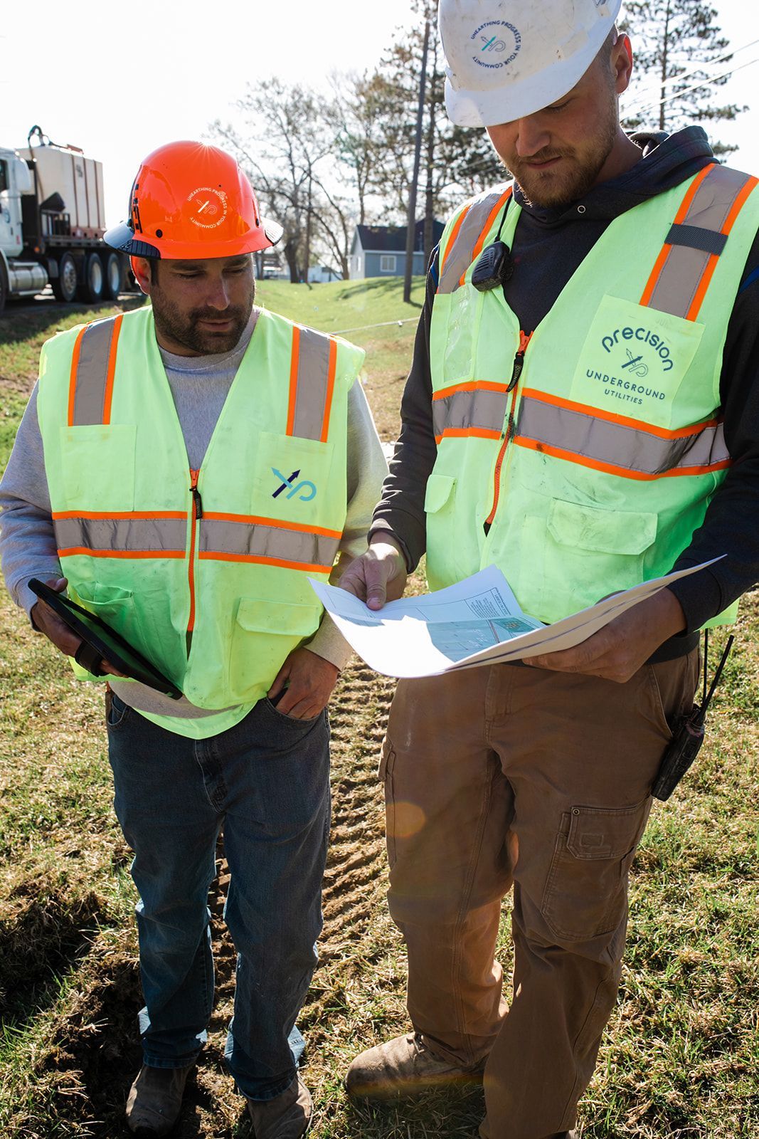 Underground Utility workers looking at map