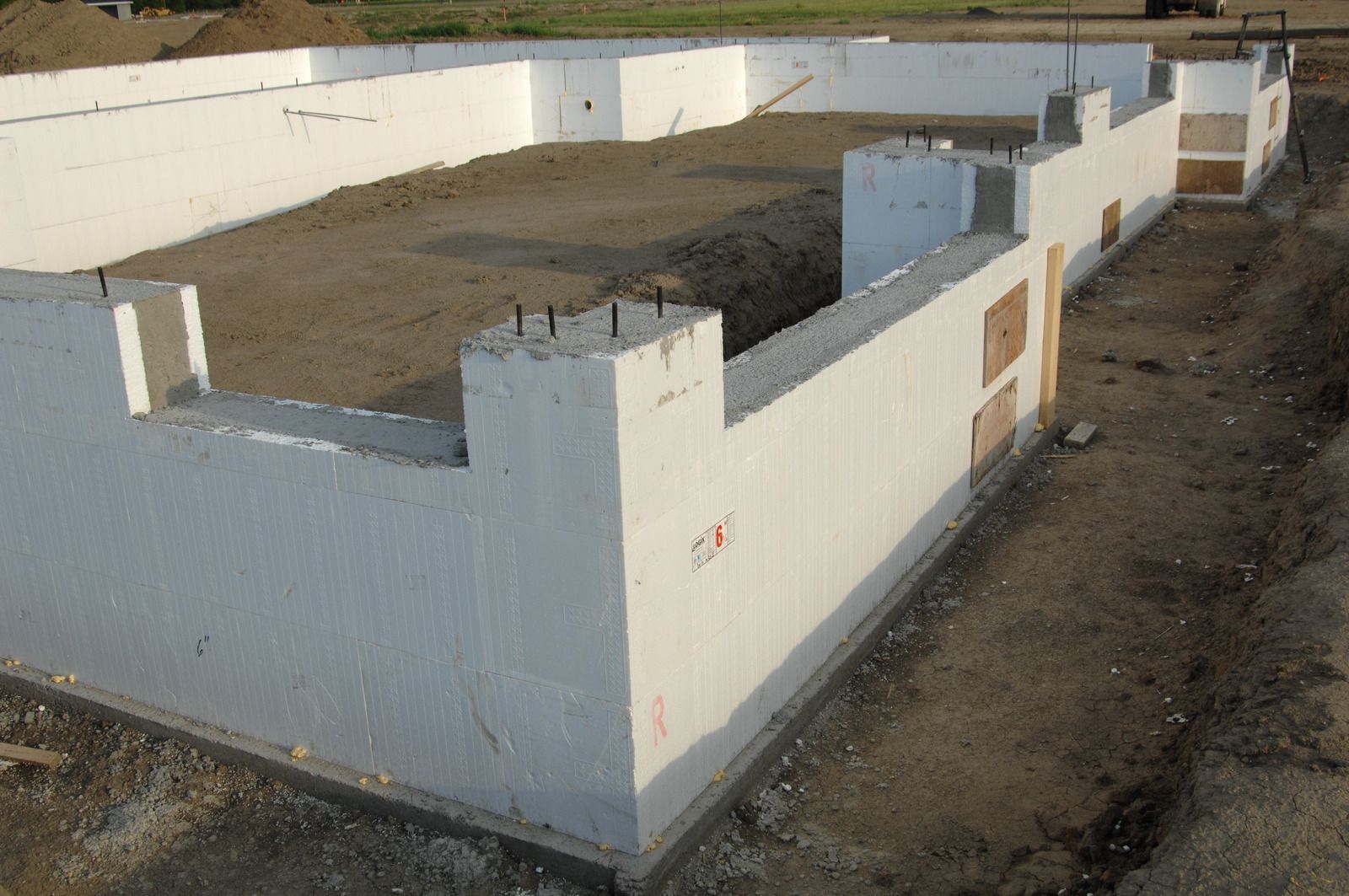 A foundation of a house is being built with styrofoam blocks