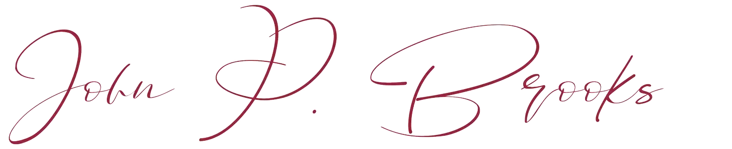 Red handwritten signature reading “John P. Brooks” on a white background