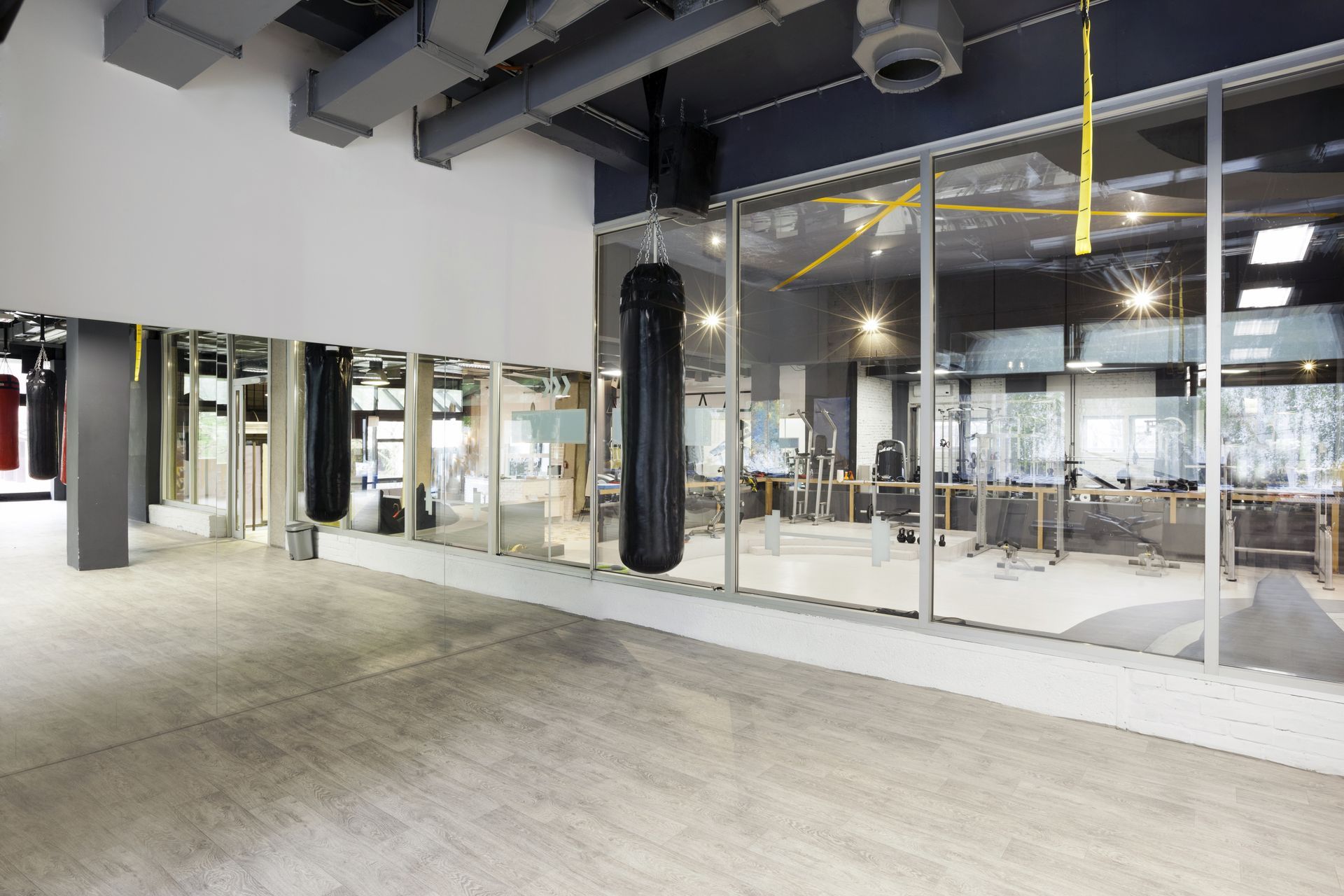 modern-dark-fitness-gym-centre-interior-design-with-sports-training-equipment-treadmills