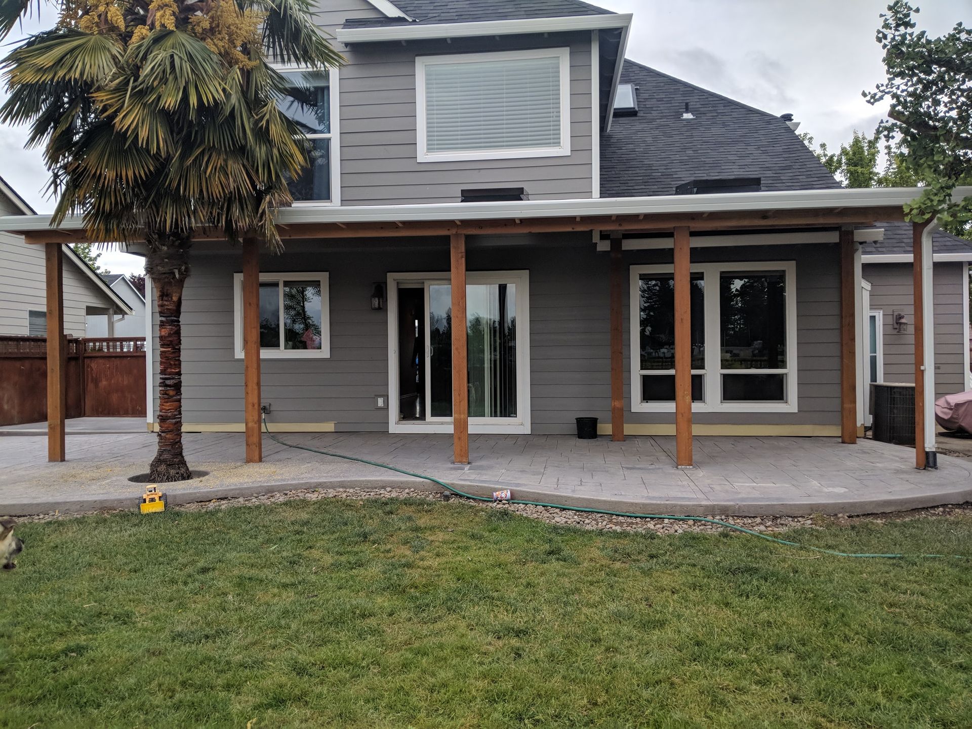 Empty, light-floored room with white walls, recessed lighting, and a small built-in bench.