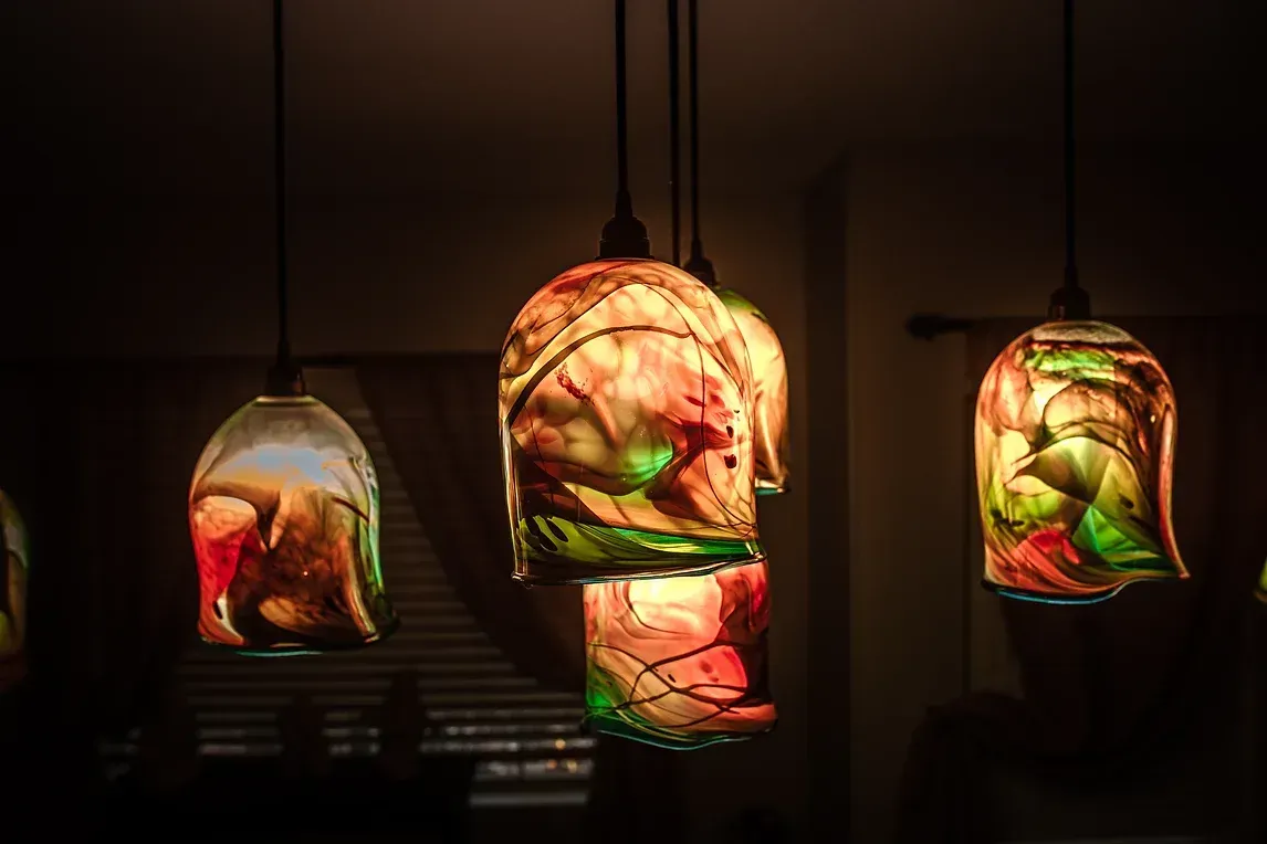 A row of colorful pendant lights hanging from the ceiling