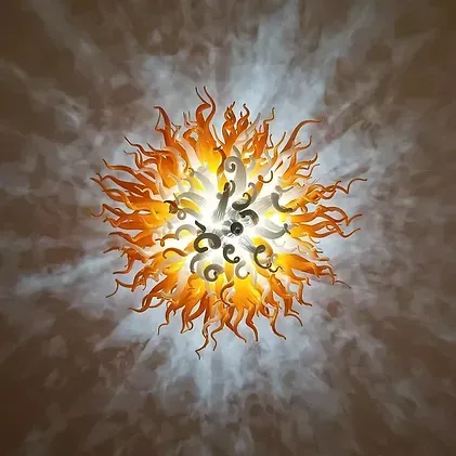 A ceiling light that looks like a sun with flames coming out of it