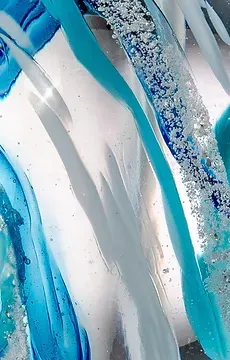 A close up of a blue and white glass sculpture