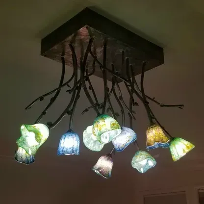 A chandelier with a lot of lights hanging from it