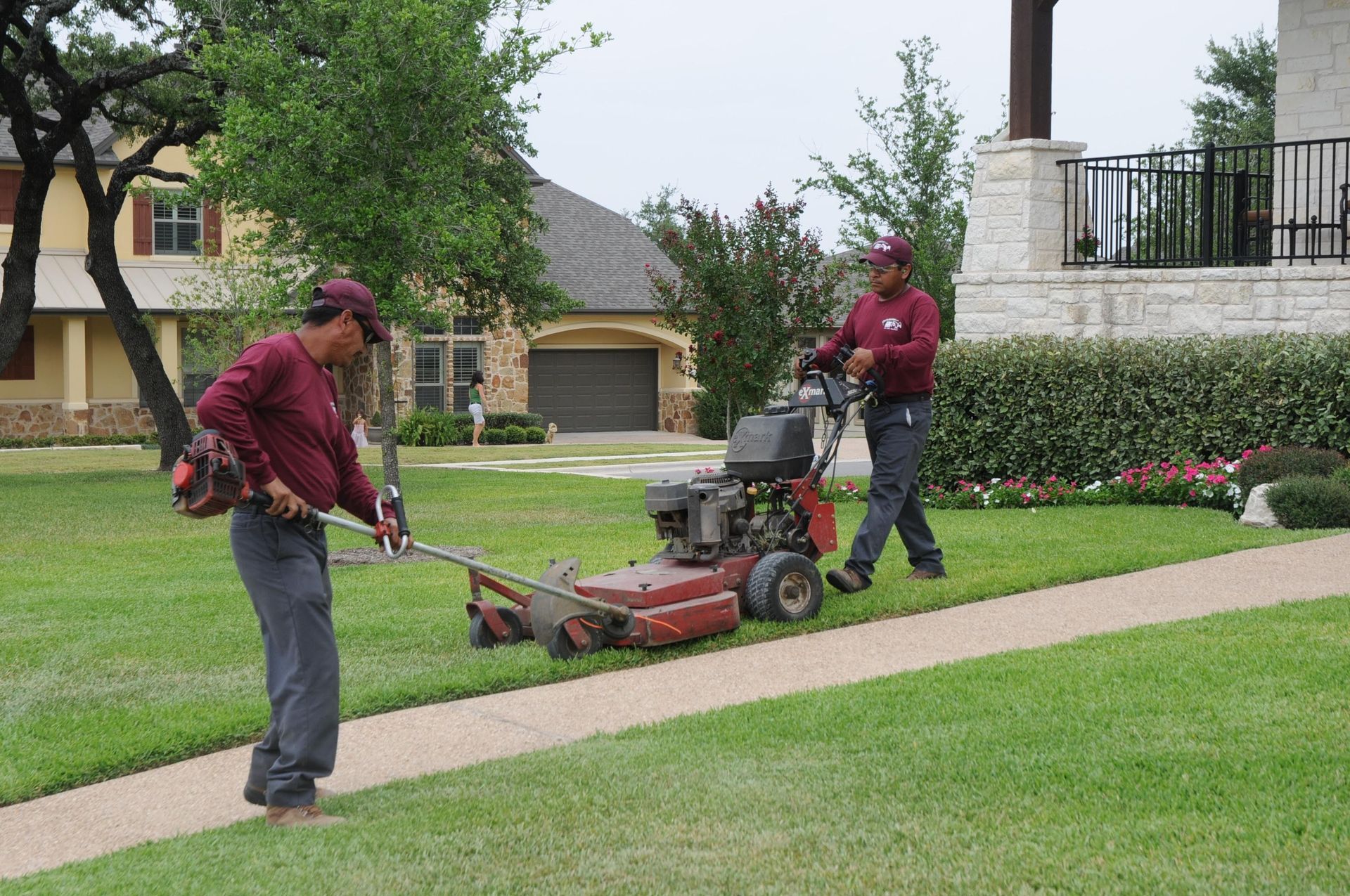 Vibrant and lush green lawn in a beautifully decorated garden, with the front lawn serving as a picturesque background.