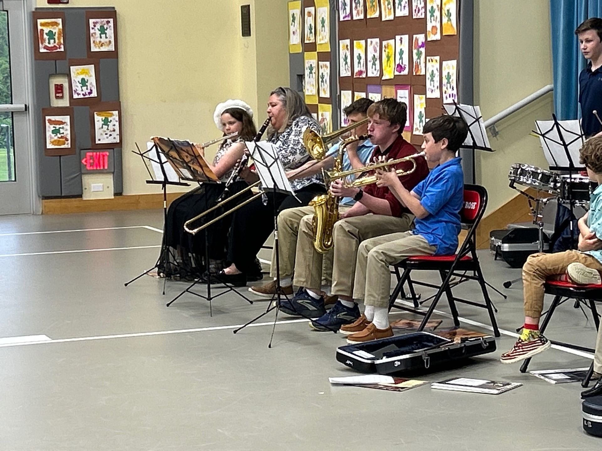 Students play musical instruments in a performance