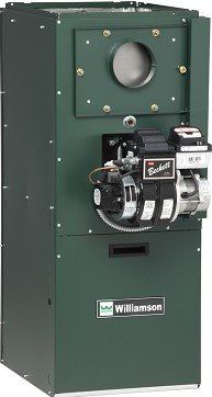 A green boiler is sitting on top of a white surface.