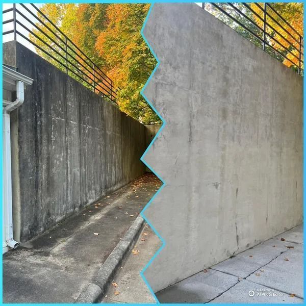 Concrete wall section, before and after cleaning. Dark, stained section on the left, clean and bright on the right.
