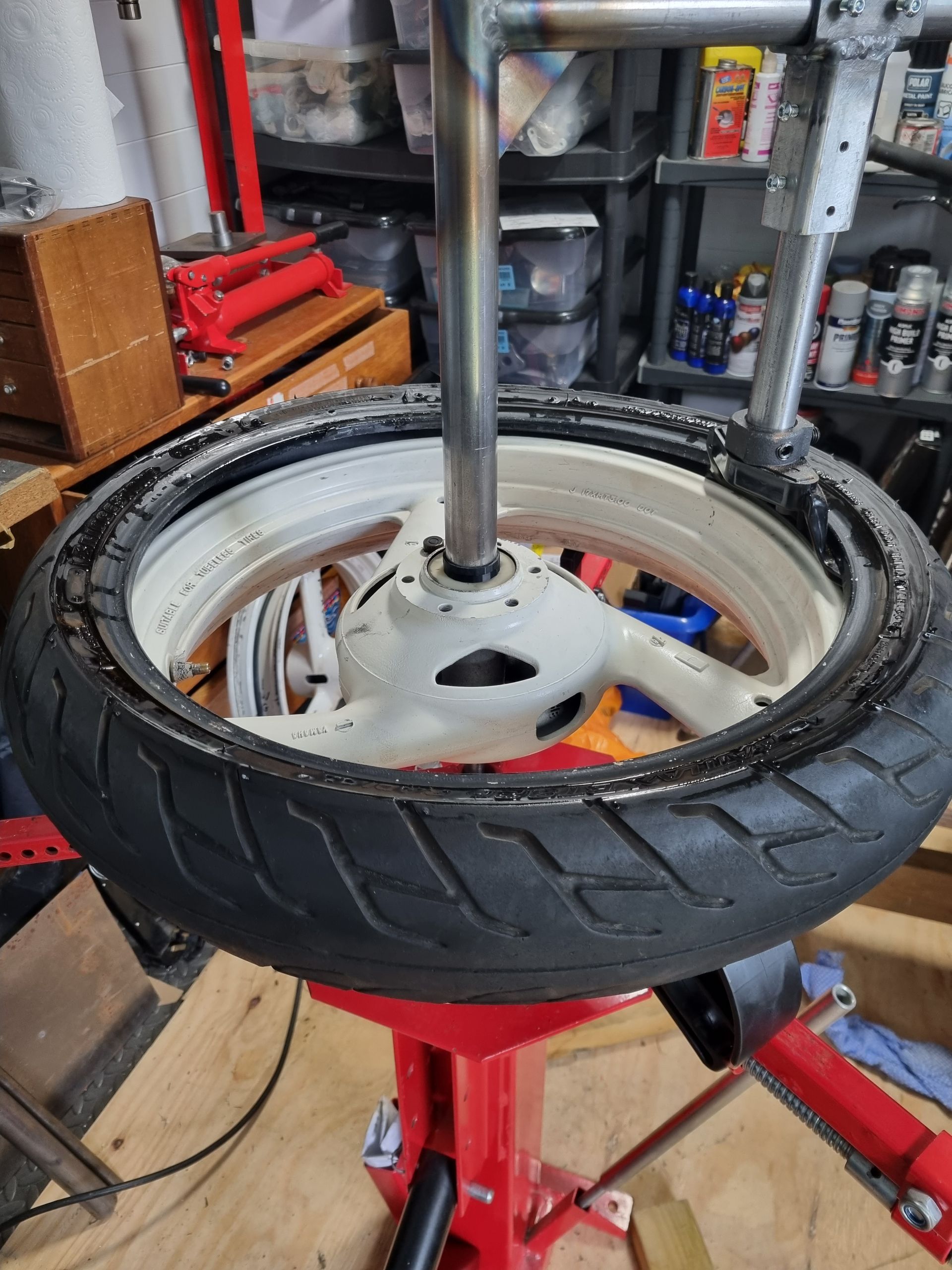 Tyre removed using duck head tyre changer