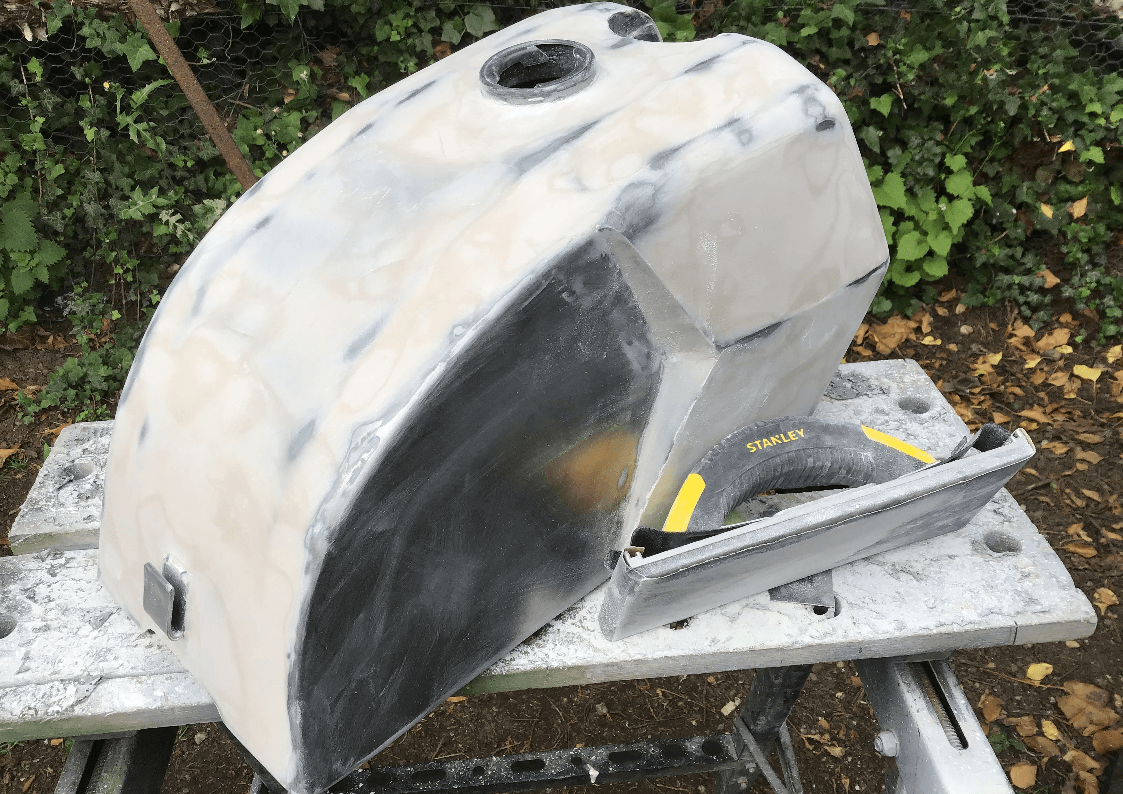 Filling and sanding motorcycle fuel tank