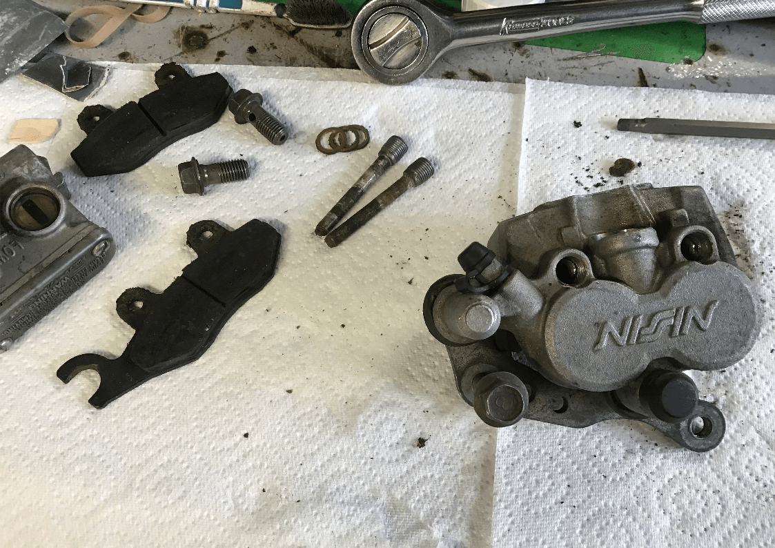 YZ125 Brake Overhaul removing the pads