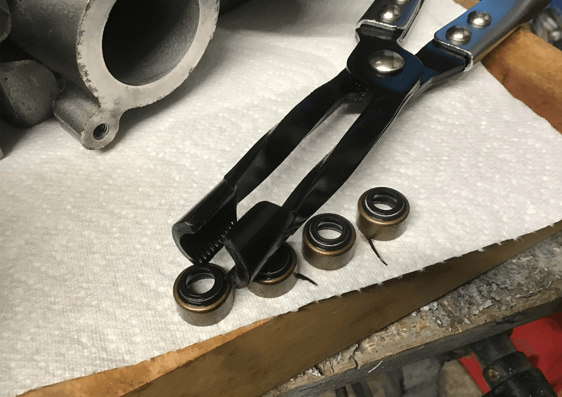 Using valve stem seal removal pliers
