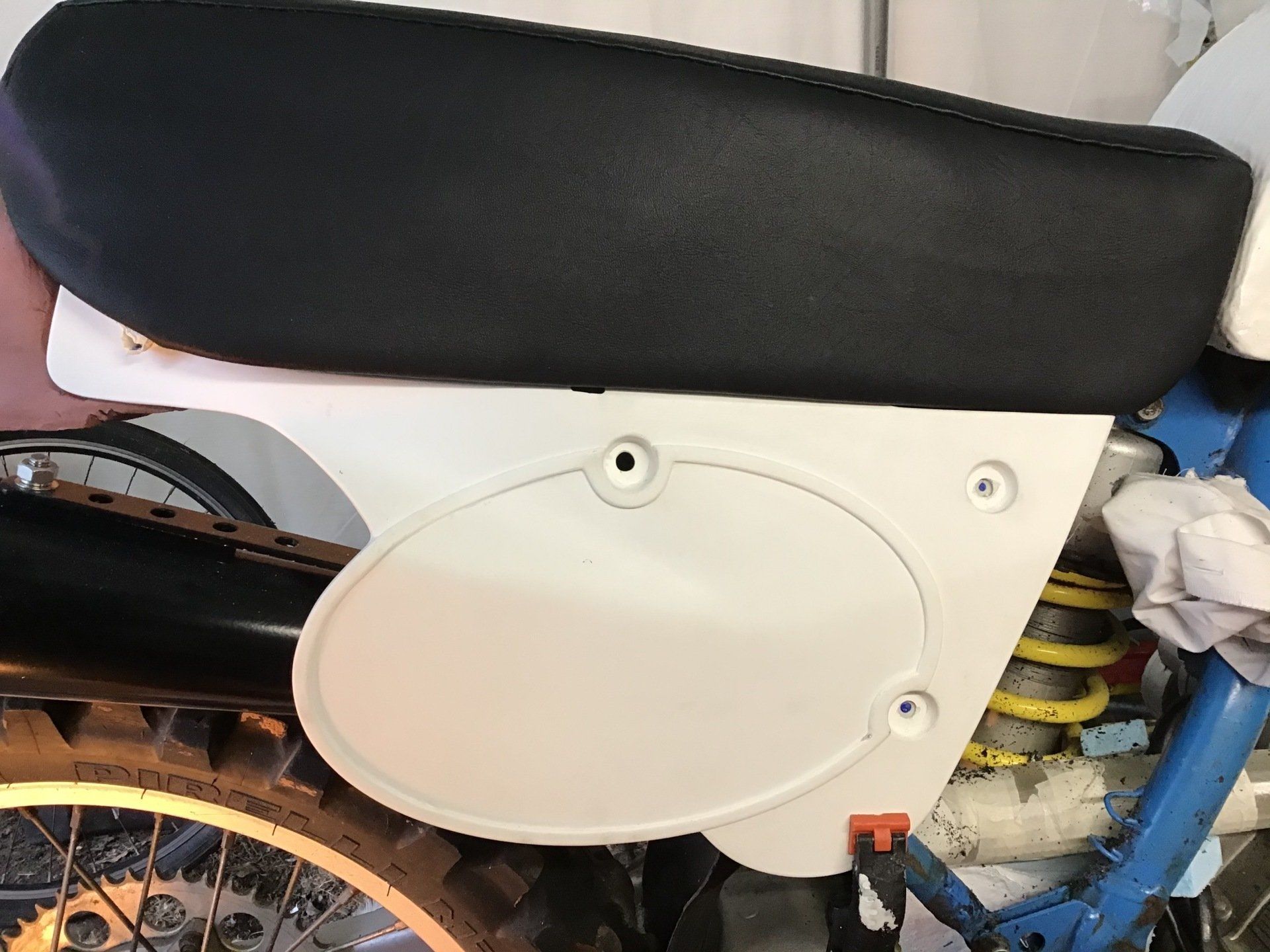 Positioning motorcycle side panels