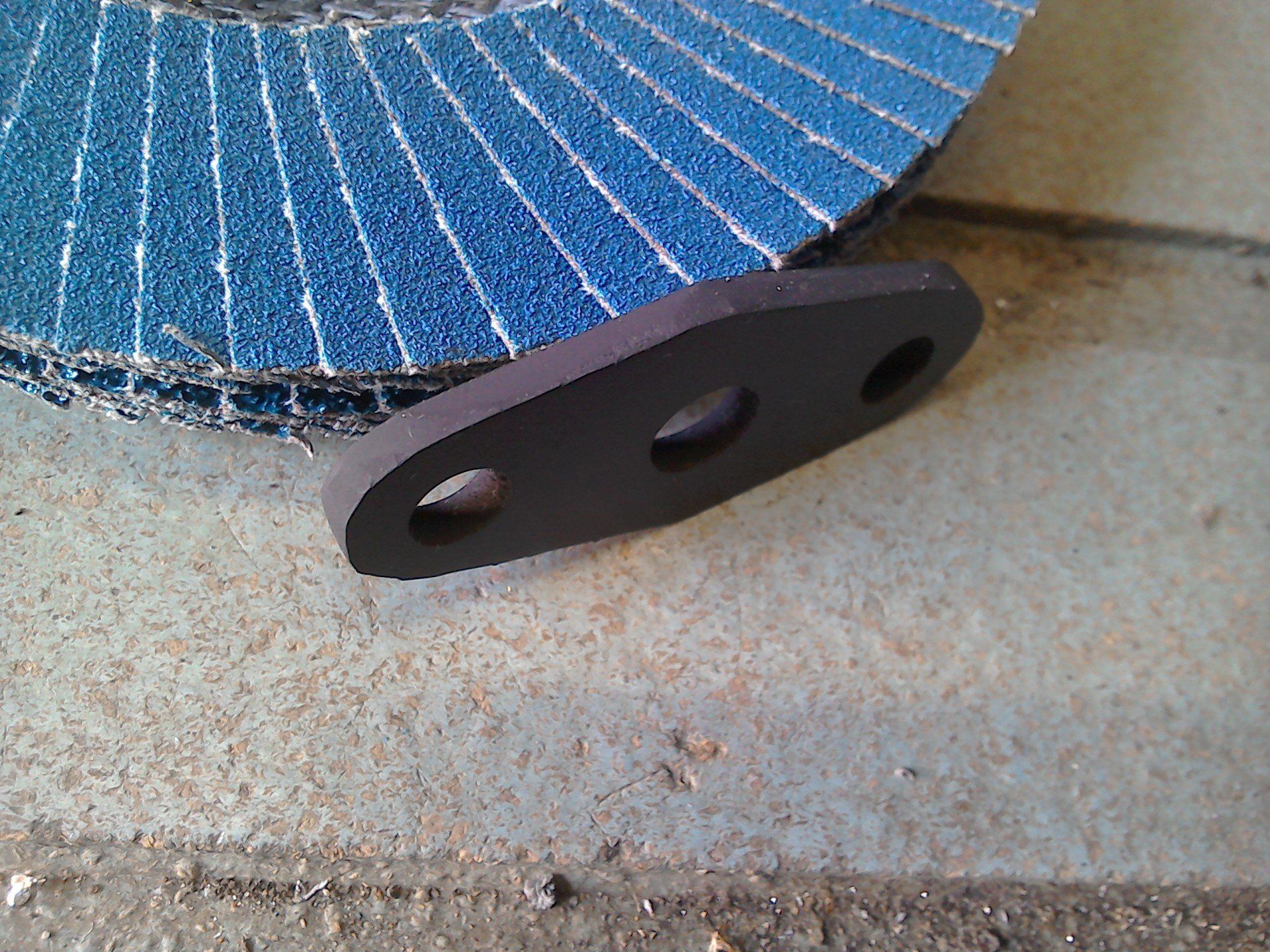 Viton gasket, edges trimmed by flap disc.