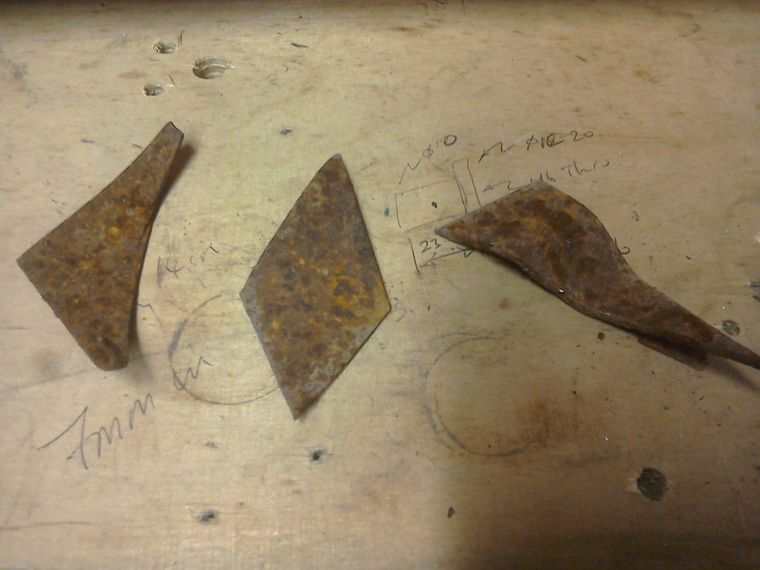 Three rusty test specimens