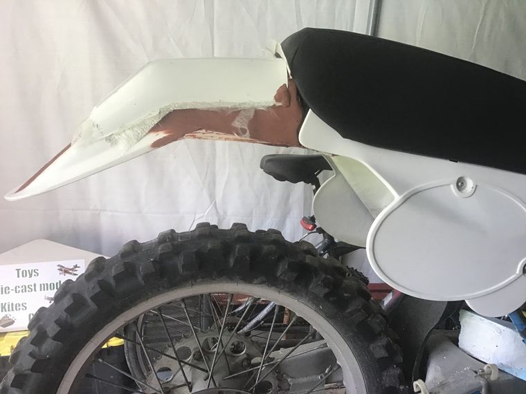 Adjustable rear motorcycle mudguard