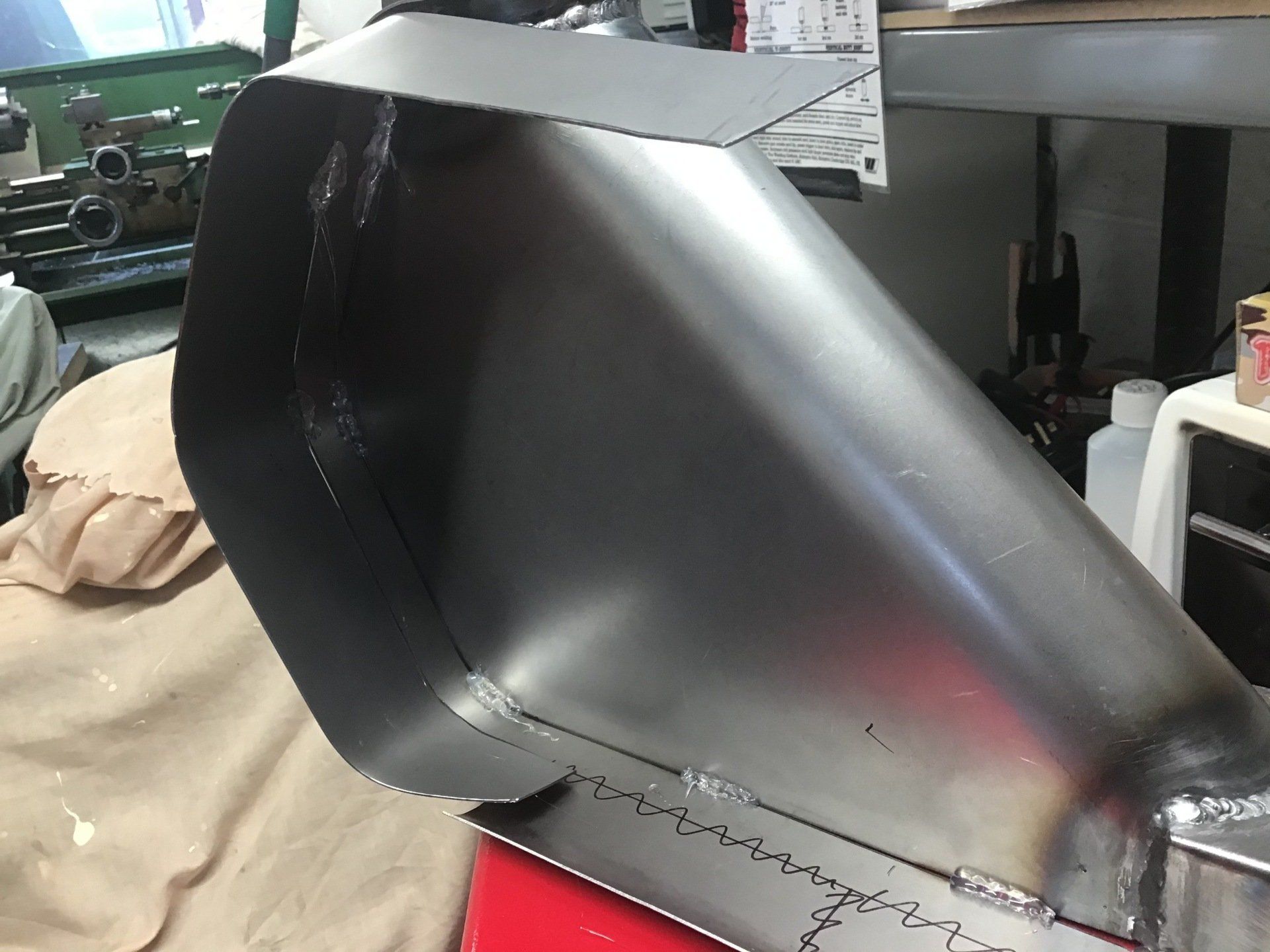 Fitting sides to steel fuel tank
