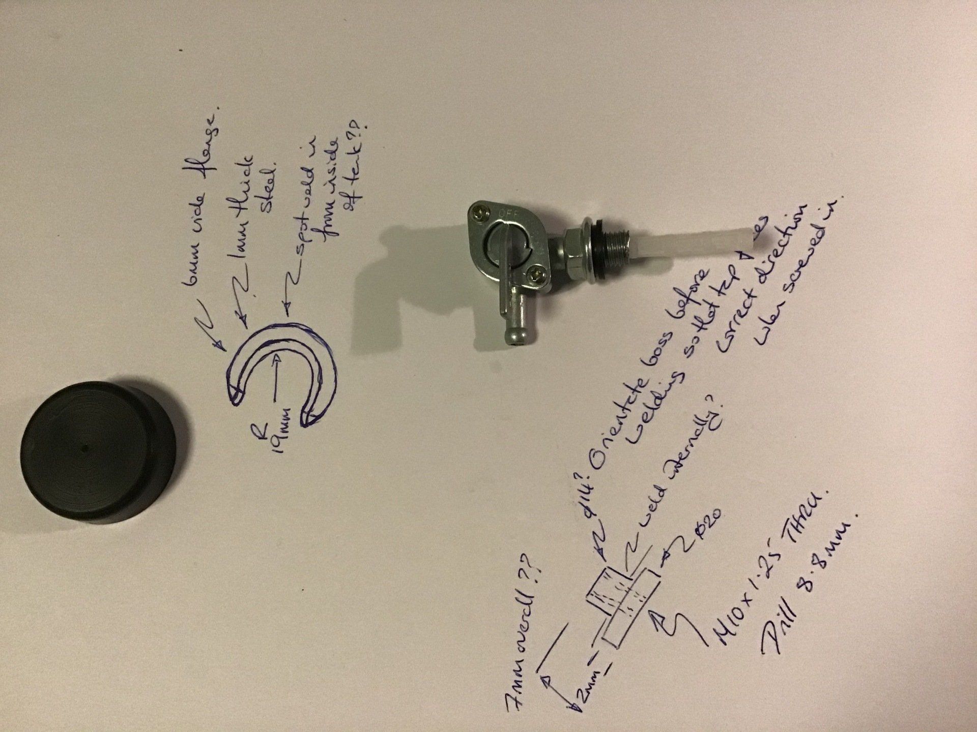 Rough sketches of motorcycle tank fittings