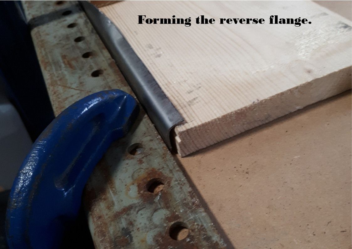Forming a flange in sheet metal