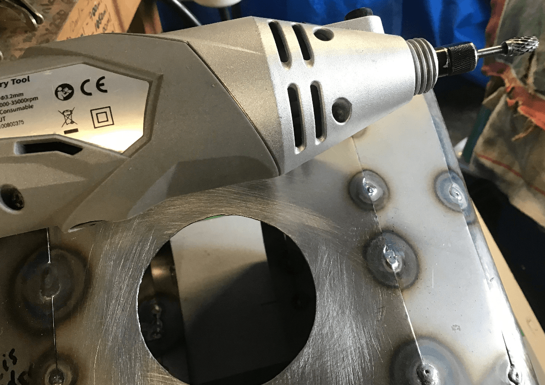 Tiding fuel filler hole using carbide burr and rotary tool