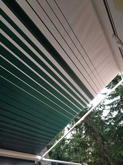 happy client's roll up awning on their RV after they installed it