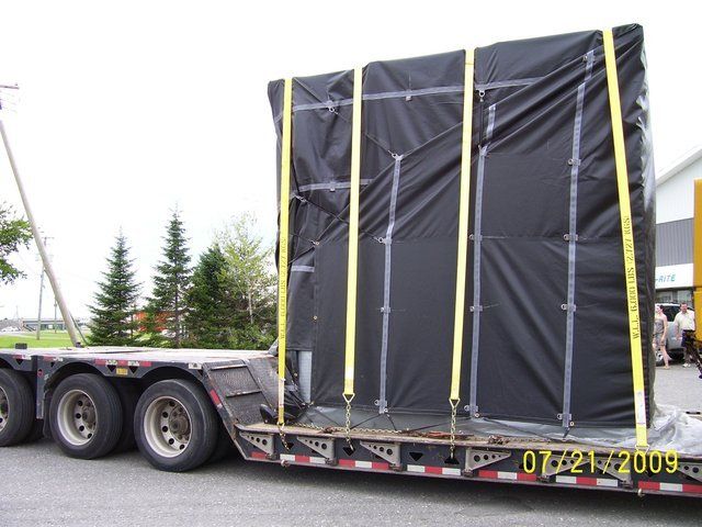 Cover-Tech Inc. Flatbed Tarps Custom made truck tarp covering crated machinery