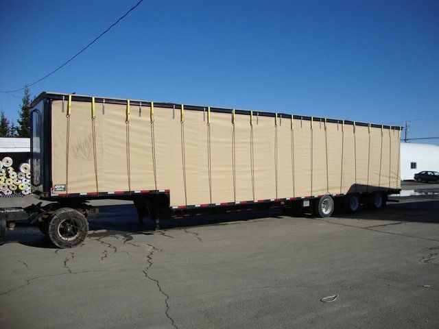 Cover-Tech Inc. flatbed tarps Rolling side curtains on a chicken trailer